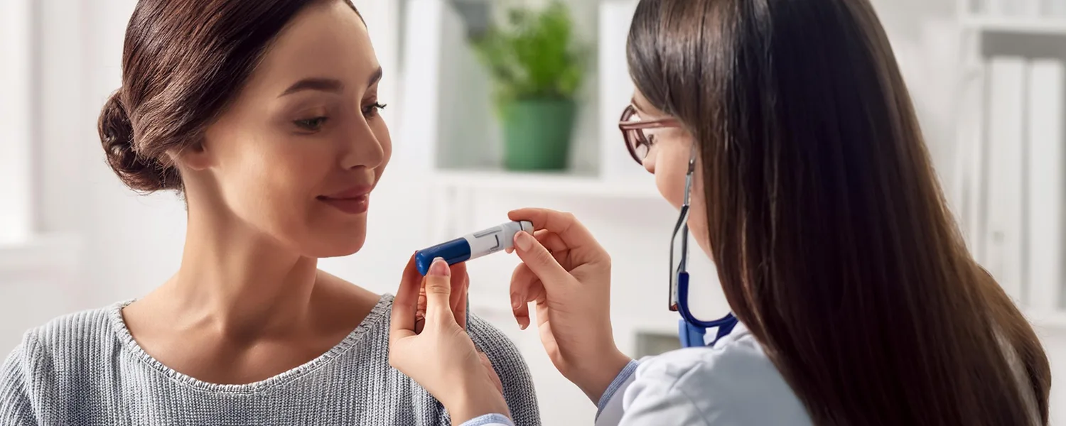 Doctor and patient discussing the use of an EpiPen